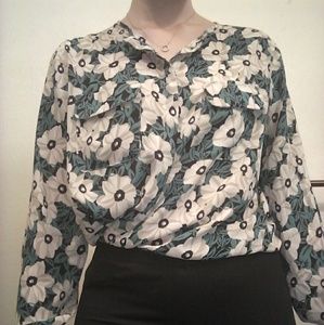 Light teal blouse with tan and black flowers